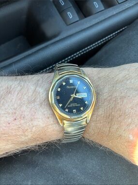Armitron Gold-Tone Watch with Black Dial and Day-Date